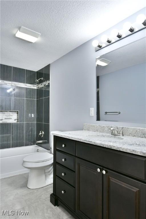 22 Camrose Dr, Niles, OH 44446 - bathroom with vanity, shower / bathtub combination, and a textured ceiling