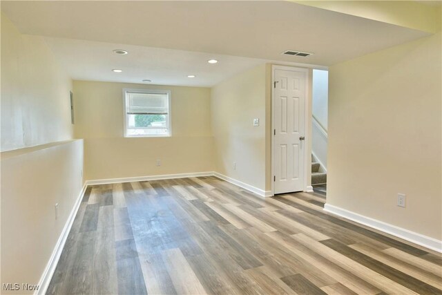 22 Camrose Dr, Niles, OH 44446 - empty room with wood finished floors, stairway, and recessed lighting