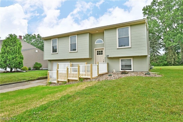 22 Camrose Dr, Niles, OH 44446 - split foyer home with a front lawn, concrete driveway, a deck, and a garage