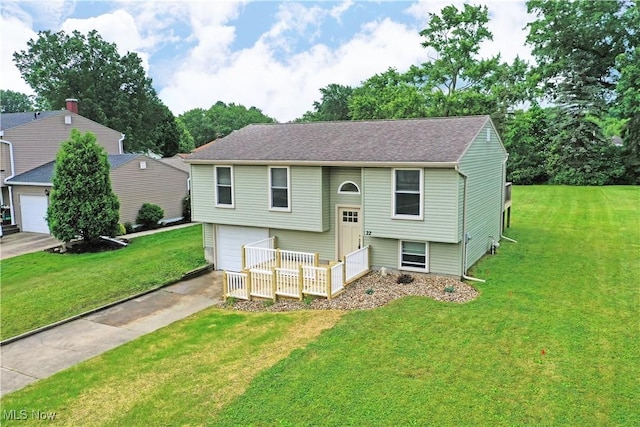 22 Camrose Dr, Niles, OH 44446 - bi-level home featuring concrete driveway, a front yard, a garage, and a shingled roof