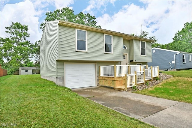 22 Camrose Dr, Niles, OH 44446 - view of front facade featuring an attached garage, a front lawn, driveway, and a wooden deck