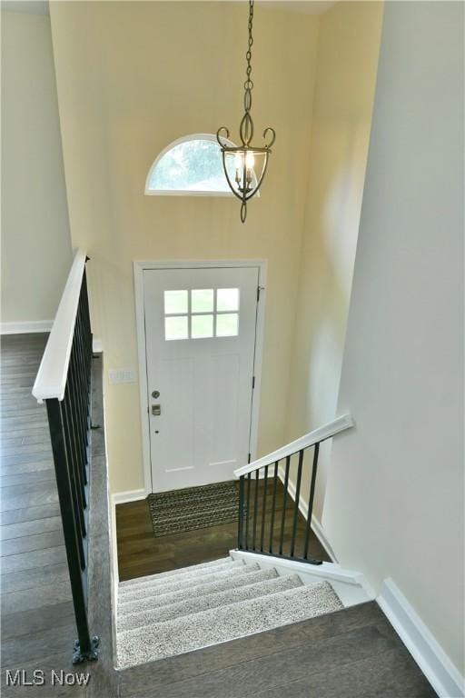 22 Camrose Dr, Niles, OH 44446 - entryway with stairway, wood finished floors, a chandelier, and a high ceiling