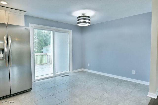 22 Camrose Dr, Niles, OH 44446 - unfurnished dining area with baseboards and light tile patterned floors