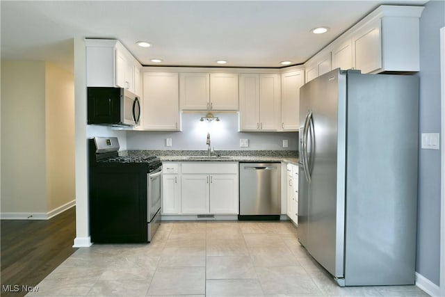 22 Camrose Dr, Niles, OH 44446 - kitchen featuring appliances with stainless steel finishes, light stone counters, recessed lighting, and white cabinets