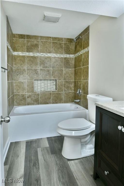 22 Camrose Dr, Niles, OH 44446 - bathroom featuring wood finished floors, vanity, and shower / washtub combination
