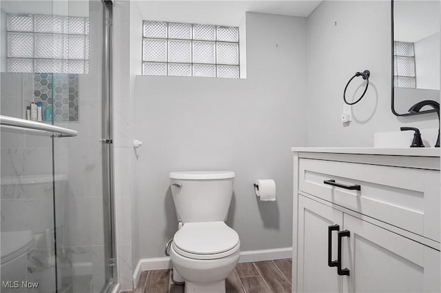 3382 Ormond Rd, Cleveland Heights, OH 44118 - bathroom featuring vanity, wood finished floors, and a stall shower
