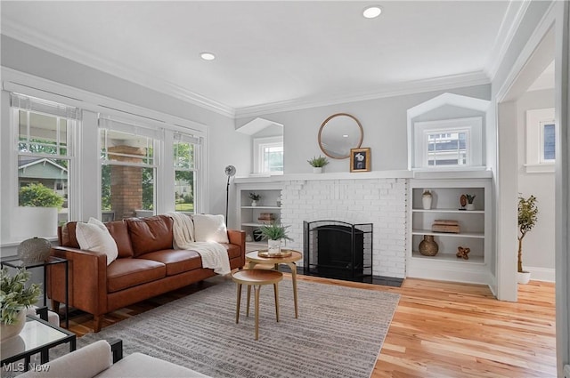 3382 Ormond Rd, Cleveland Heights, OH 44118 - living room with crown molding, light wood finished floors, a fireplace, and recessed lighting