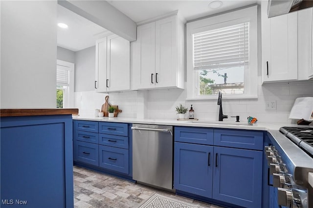 3382 Ormond Rd, Cleveland Heights, OH 44118 - kitchen featuring stainless steel appliances, blue cabinets, backsplash, and white cabinets