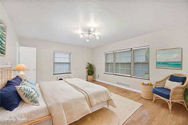 15875 Van Aken Blvd Unit 101C, Shaker Heights, OH 44120 - bedroom with light wood finished floors and baseboards