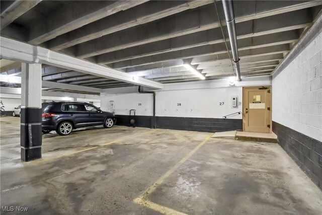 15875 Van Aken Blvd Unit 101C, Shaker Heights, OH 44120 - parking deck featuring concrete block wall