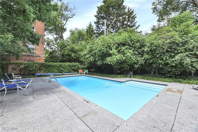 15875 Van Aken Blvd Unit 101C, Shaker Heights, OH 44120 - view of pool with a patio and a fenced backyard