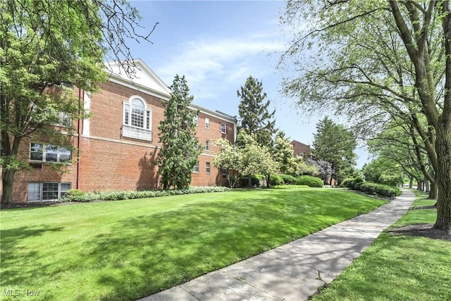 15875 Van Aken Blvd Unit 101C, Shaker Heights, OH 44120 - view of property's community with a lawn