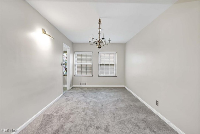 15875 Van Aken Blvd Unit 101C, Shaker Heights, OH 44120 - empty room featuring a chandelier and carpet flooring