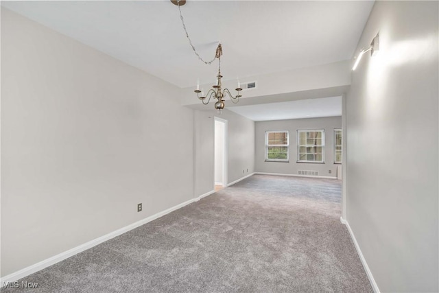 15875 Van Aken Blvd Unit 101C, Shaker Heights, OH 44120 - carpeted empty room with a chandelier and baseboards
