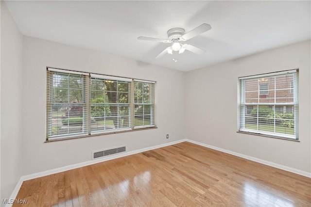 15875 Van Aken Blvd Unit 101C, Shaker Heights, OH 44120 - unfurnished room featuring wood finished floors and a ceiling fan