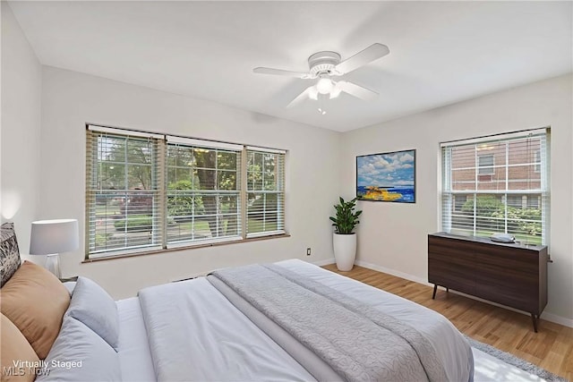 15875 Van Aken Blvd Unit 101C, Shaker Heights, OH 44120 - bedroom with wood finished floors and a ceiling fan