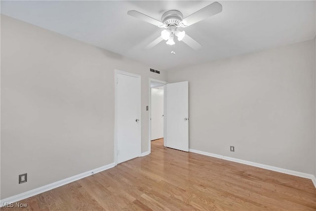15875 Van Aken Blvd Unit 101C, Shaker Heights, OH 44120 - empty room with light wood-style flooring and a ceiling fan