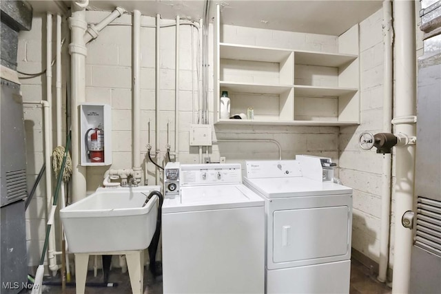 15875 Van Aken Blvd Unit 101C, Shaker Heights, OH 44120 - washroom featuring washer and clothes dryer and concrete block wall