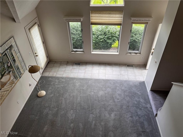 1235 Canyon View Rd, Sagamore Hills, OH 44067 - unfurnished living room with carpet and tile patterned floors