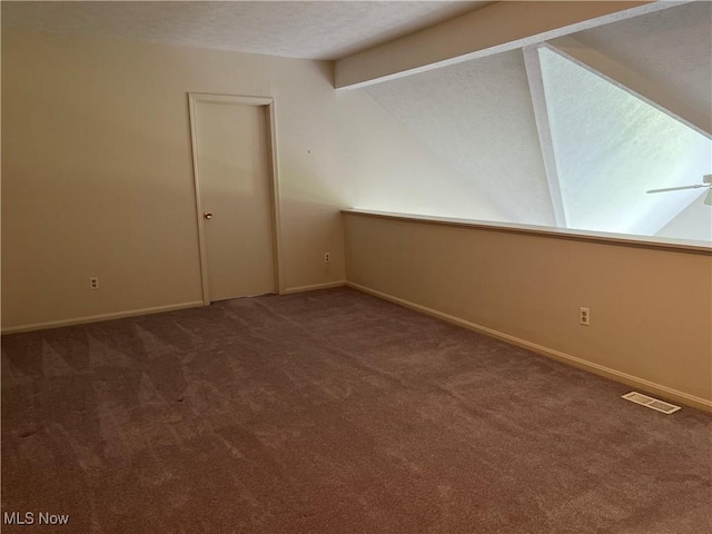 1235 Canyon View Rd, Sagamore Hills, OH 44067 - carpeted spare room with vaulted ceiling and a textured ceiling