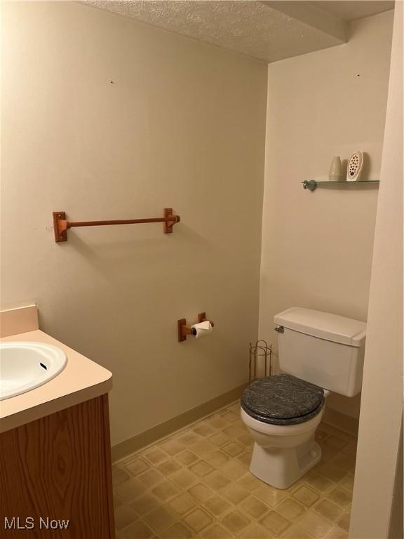 1235 Canyon View Rd, Sagamore Hills, OH 44067 - half bath with vanity and a textured ceiling