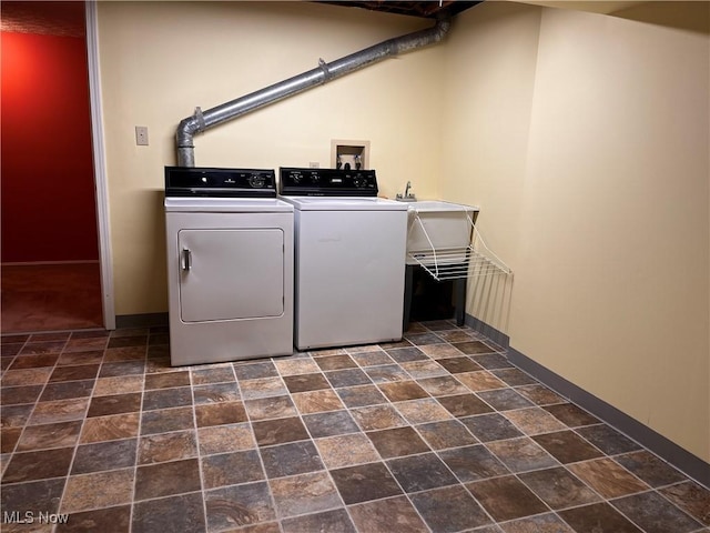 1235 Canyon View Rd, Sagamore Hills, OH 44067 - washroom featuring washer and clothes dryer and stone finish flooring