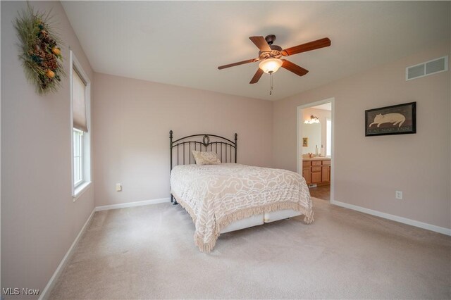 125 Fitch Blvd Unit 263, Austintown, OH 44515 - bedroom with light colored carpet, ceiling fan, and ensuite bath