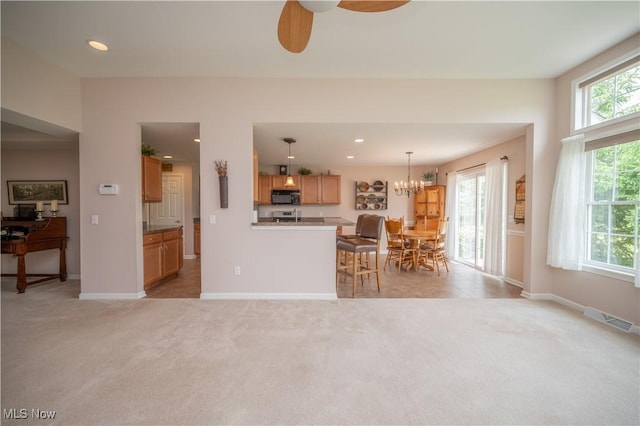125 Fitch Blvd Unit 263, Austintown, OH 44515 - kitchen featuring black microwave, light carpet, a ceiling fan, decorative light fixtures, and recessed lighting