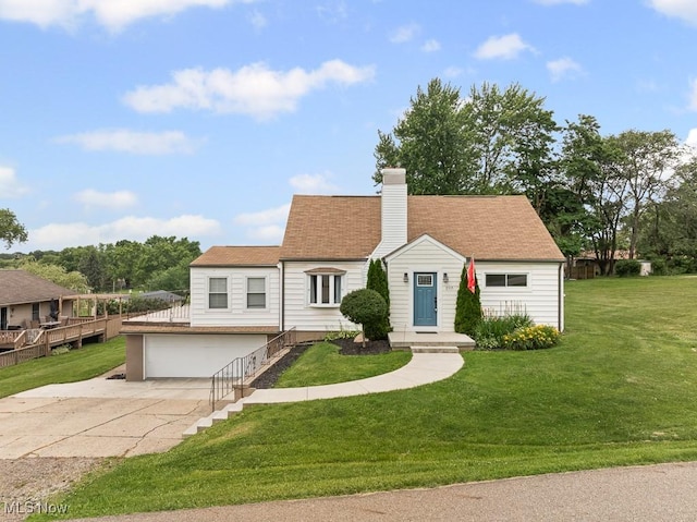 2515 Saratoga Ave SW, Canton, OH 44706 - view of front of home with a garage, driveway, a front yard, a chimney, and roof with shingles
