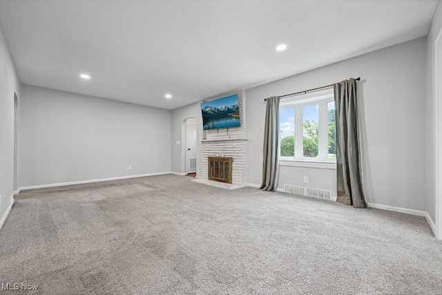 2515 Saratoga Ave SW, Canton, OH 44706 - unfurnished living room featuring carpet, a fireplace, and recessed lighting
