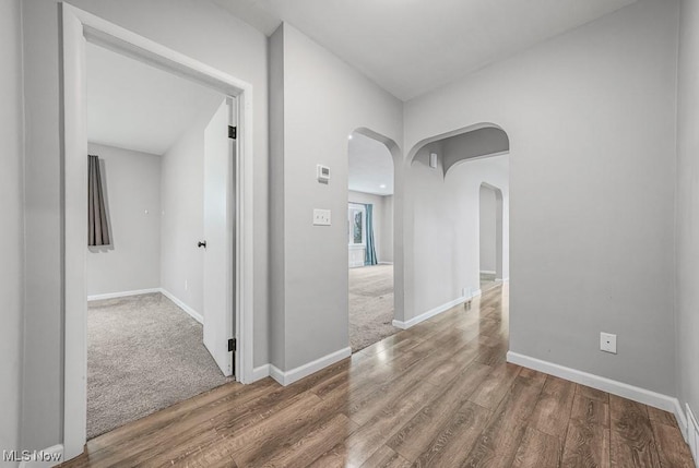 2515 Saratoga Ave SW, Canton, OH 44706 - hallway with arched walkways and wood finished floors
