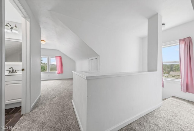 2515 Saratoga Ave SW, Canton, OH 44706 - corridor featuring carpet floors and vaulted ceiling