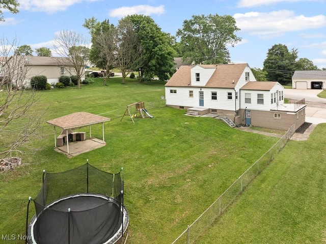 2515 Saratoga Ave SW, Canton, OH 44706 - view of yard featuring a trampoline and a playground