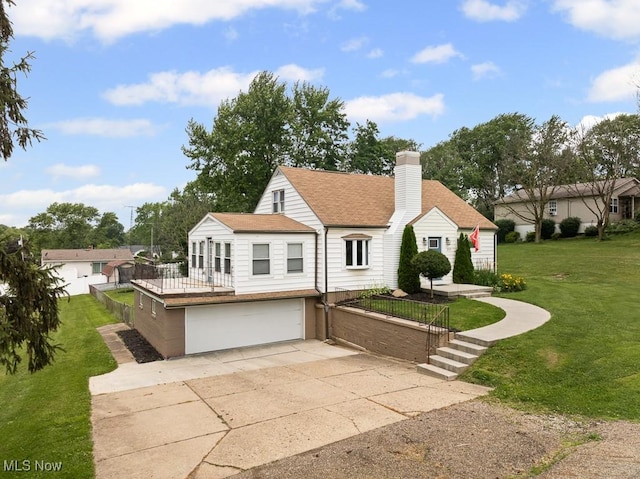 2515 Saratoga Ave SW, Canton, OH 44706 - view of front of home featuring driveway, a garage, a chimney, a front lawn, and roof with shingles