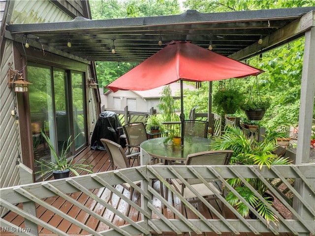 265 Schneiders Crossing Rd NW, Dover, OH 44622 - view of patio with outdoor dining area and a wooden deck