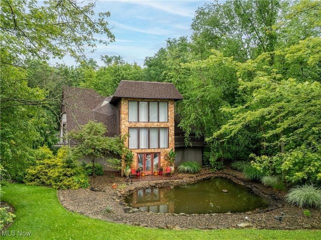 265 Schneiders Crossing Rd NW, Dover, OH 44622 - back of house featuring roof with shingles