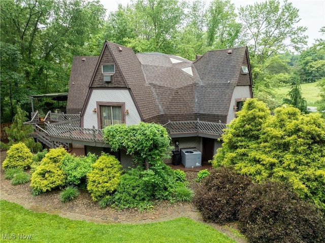 265 Schneiders Crossing Rd NW, Dover, OH 44622 - rear view of house with roof with shingles and a wooden deck