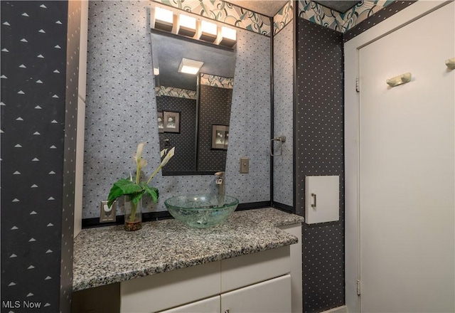 265 Schneiders Crossing Rd NW, Dover, OH 44622 - bathroom featuring wallpapered walls and vanity