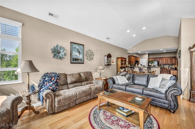 3845 Windsor Bridge Cir, Huron, OH 44839 - living area with vaulted ceiling, light wood-style flooring, and recessed lighting