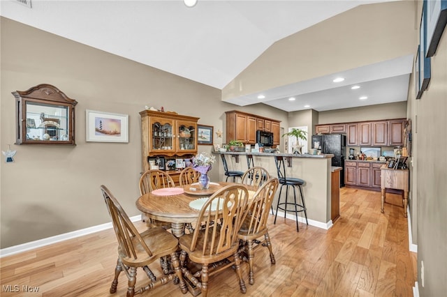 3845 Windsor Bridge Cir, Huron, OH 44839 - dining space with lofted ceiling, light wood-type flooring, and recessed lighting