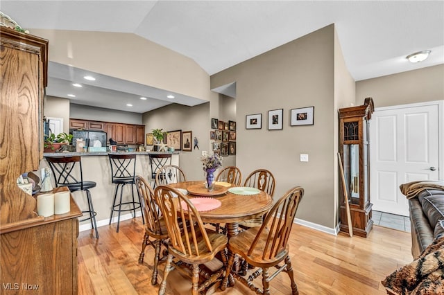 3845 Windsor Bridge Cir, Huron, OH 44839 - dining room with lofted ceiling and light wood-style floors