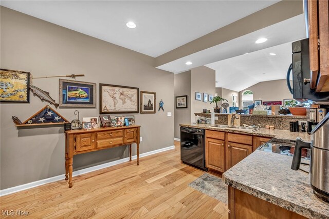 3845 Windsor Bridge Cir, Huron, OH 44839 - kitchen with dishwasher, a peninsula, light wood finished floors, lofted ceiling, and brown cabinetry