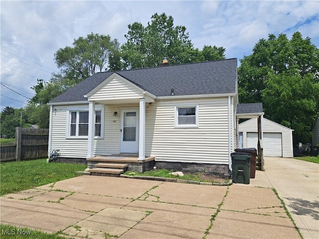 2239 N Ridge Rd E, Lorain, OH 44055 - bungalow-style house featuring driveway, an outdoor structure, and a shingled roof