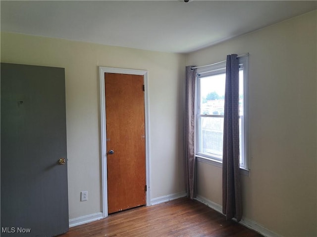 2239 N Ridge Rd E, Lorain, OH 44055 - unfurnished bedroom with wood finished floors and baseboards