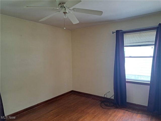 2239 N Ridge Rd E, Lorain, OH 44055 - empty room with wood finished floors and a ceiling fan