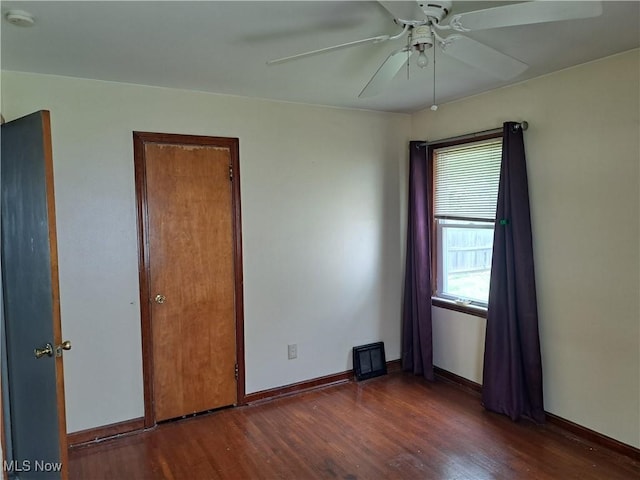 2239 N Ridge Rd E, Lorain, OH 44055 - spare room with wood finished floors, a smoke detector, and a ceiling fan