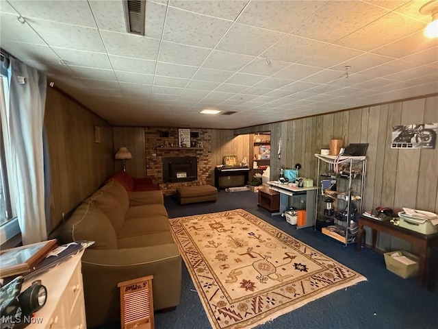 213 Highland Park, Bloomingdale, OH 43910 - living area featuring wood walls, carpet flooring, and a fireplace