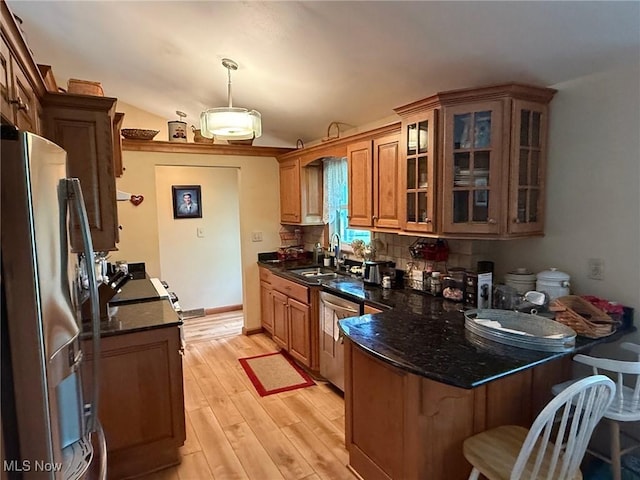 213 Highland Park, Bloomingdale, OH 43910 - kitchen featuring stainless steel appliances, a peninsula, light wood-type flooring, glass insert cabinets, and dark stone countertops