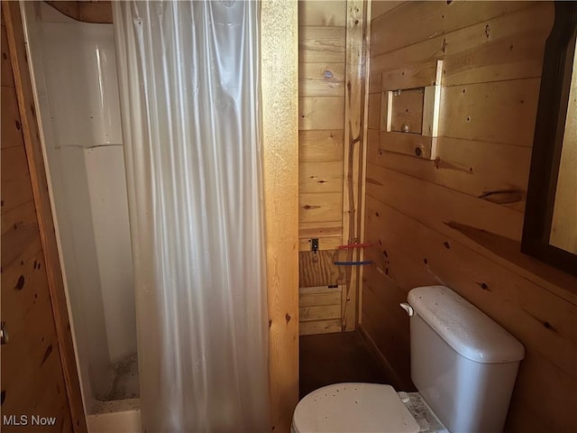 61342 High Hill Rd, Cambridge, OH 43725 - bathroom with wood walls and a shower with shower curtain