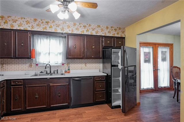2691 State Route 339, Belpre, OH 45714 - kitchen featuring dishwasher, french doors, light countertops, freestanding refrigerator, and light wood-style flooring
